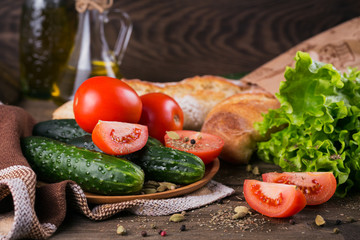 tomato, cucumber, lettuce, baguette, olive oil and spices