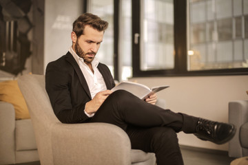 Elegant man reading