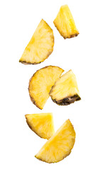Falling slices of pineapple isolated on white