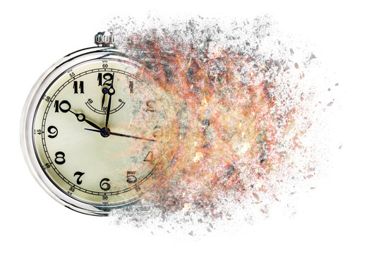  Time is running out concept shows clock that is dissolving away into little particles.