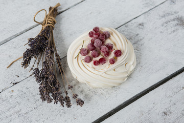 Pavlova cakes with cream and fresh summer berries - 192381918