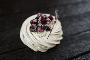 Pavlova cakes with cream and fresh summer berries - 192381939
