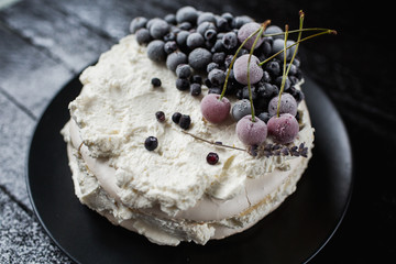 Pavlova cakes with cream and fresh summer berries - 192381975