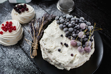 Pavlova cakes with cream and fresh summer berries - 192381994