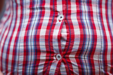 Weight loss, junk food, overweight, dieting concept. Tight shirt on obese belly,close up