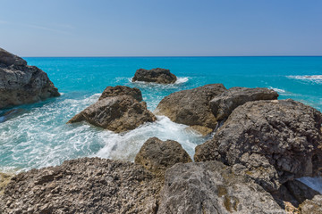 Fototapeta na wymiar Amazing landscape of blue waters of Megali Petra Beach, Lefkada, Ionian Islands, Greece