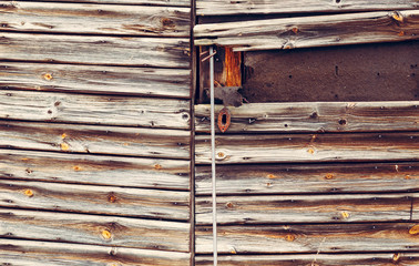 Old wooden door with padlock