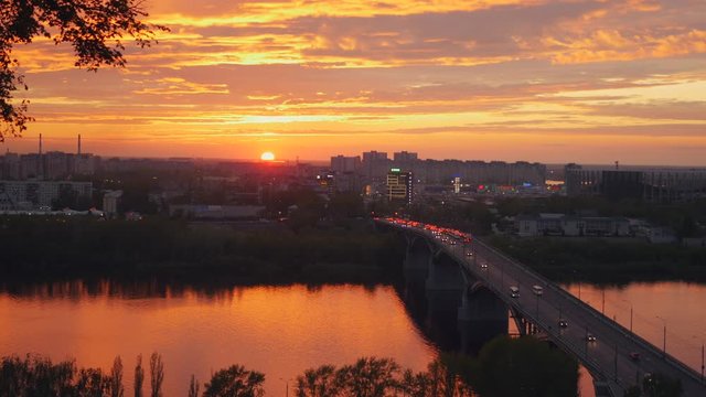 Sunset over the city, river and bridge