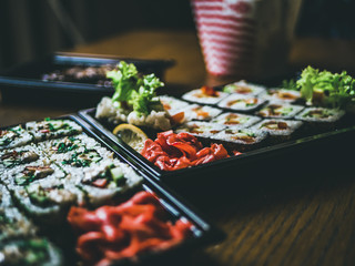 Multicolored rolls rice caviar and salmon eel trout on the table