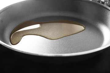 Frying pan with cooking oil on stove