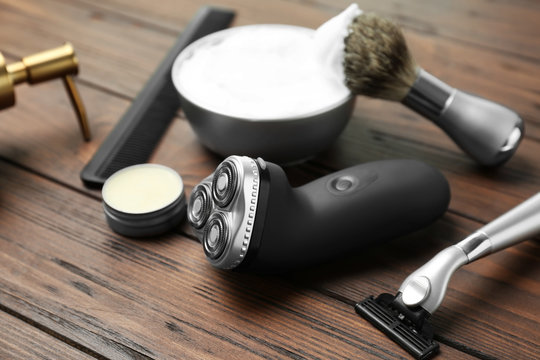Shaving accessories for man on wooden background