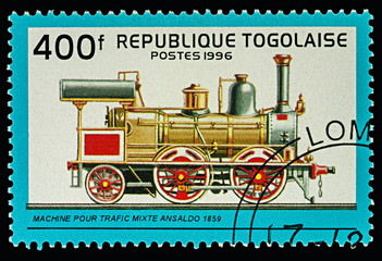 Fototapeta na wymiar Cargo and passenger locomotive (1859) on postage stamp
