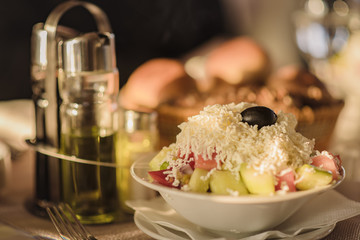 So called shopska salad, traditional addition to a meal in any restaurant, seasonal salad