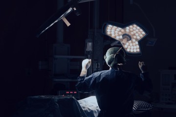 Doctor operating in operation room hospital concept