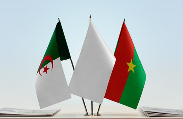 Flags of Algeria and Burkina Faso with a white flag in the middle