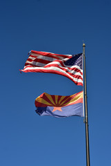 USA flag and Arizona state flag flying on one flag pole - 192393997