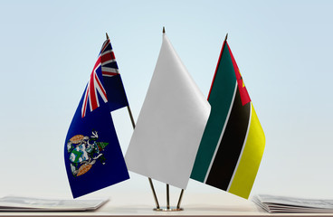 Flags of Ascension Island and Mozambique with a white flag in the middle