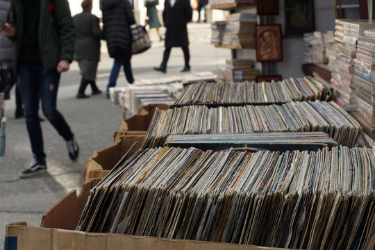 Old gramophone records and books put on sale on street