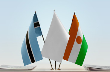 Flags of Botswana and Niger with a white flag in the middle