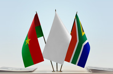 Flags of Burkina Faso and Republic of South Africa with a white flag in the middle
