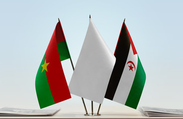 Flags of Burkina Faso and Sahrawi Arab Democratic Republic with a white flag in the middle