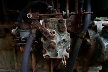 Grain Image: Close up of old machine factory made of steel and used in the past. Broken and rustic machine left over in abandon factory. Image of aged equipment with rust and gear part.