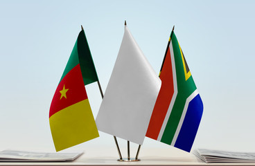 Flags of Cameroon and Republic of South Africa with a white flag in the middle