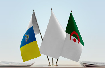 Flags of Canary Islands and Algeria with a white flag in the middle