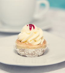 Birthday cupcake on plate. Selective focus.