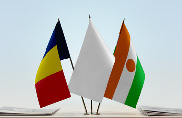 Flags of Chad and Niger with a white flag in the middle