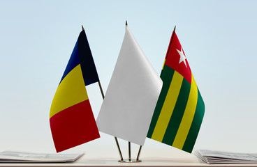 Flags of Chad and Togo with a white flag in the middle