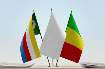 Flags of Comoros and Mali with a white flag in the middle