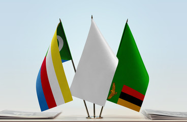 Flags of Comoros and Zambia with a white flag in the middle