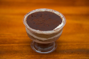 Delicious tiramisu cakes in plastic glass
