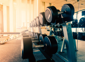 Rack of dummbell in fitness room in the morning