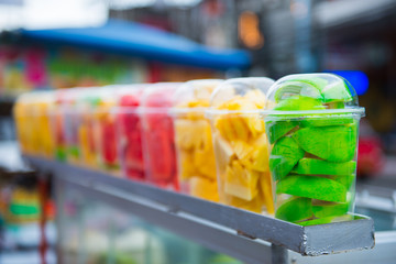 Various fruit in plastic glass