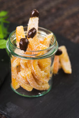 Orange slices in dark chocolate, close-up
