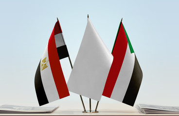 Flags of Egypt and Sudan with a white flag in the middle