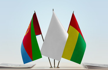 Flags of Eritrea and Guinea-Bissau with a white flag in the middle