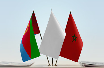 Flags of Eritrea and Morocco with a white flag in the middle