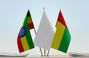 Flags of Ethiopia and Guinea-Bissau with a white flag in the middle