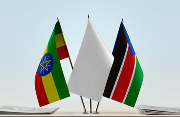 Flags of Ethiopia and South Sudan with a white flag in the middle