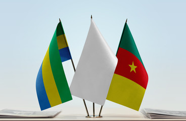 Flags of Gabon and Cameroon with a white flag in the middle