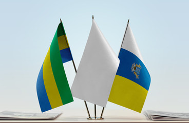 Flags of Gabon and Canary Islands with a white flag in the middle