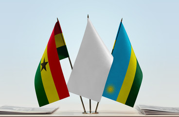 Flags of Ghana and Rwanda with a white flag in the middle