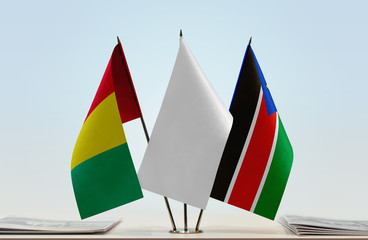 Flags of Guinea and South Sudan with a white flag in the middle