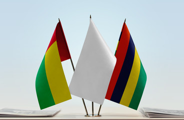 Flags of Guinea-Bissau and Mauritius with a white flag in the middle