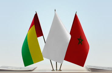 Flags of Guinea-Bissau and Morocco with a white flag in the middle