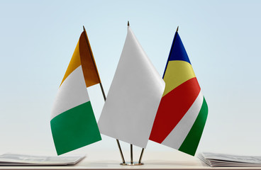 Flags of Ivory Coast and Seychelles with a white flag in the middle