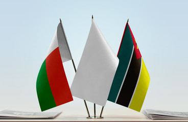 Flags of Madagascar and Mozambique with a white flag in the middle